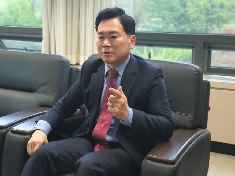 politician sitting in a chair