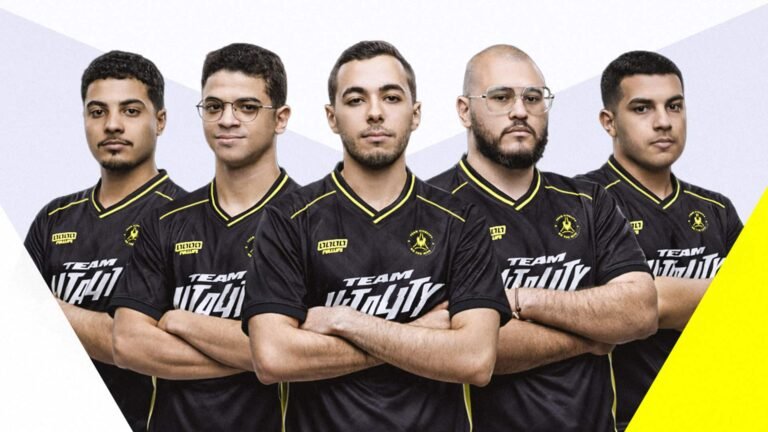 Image of Team Vitality CrossFire roster posing while wearing black jerseys on a grey background. White and yellow triangles are in the bottom corners of the image