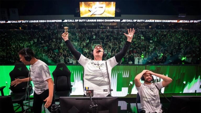 Image of OpTic Texas celebrating victory on stage at CDL Championship. Pred is screaming into the air with hands raised